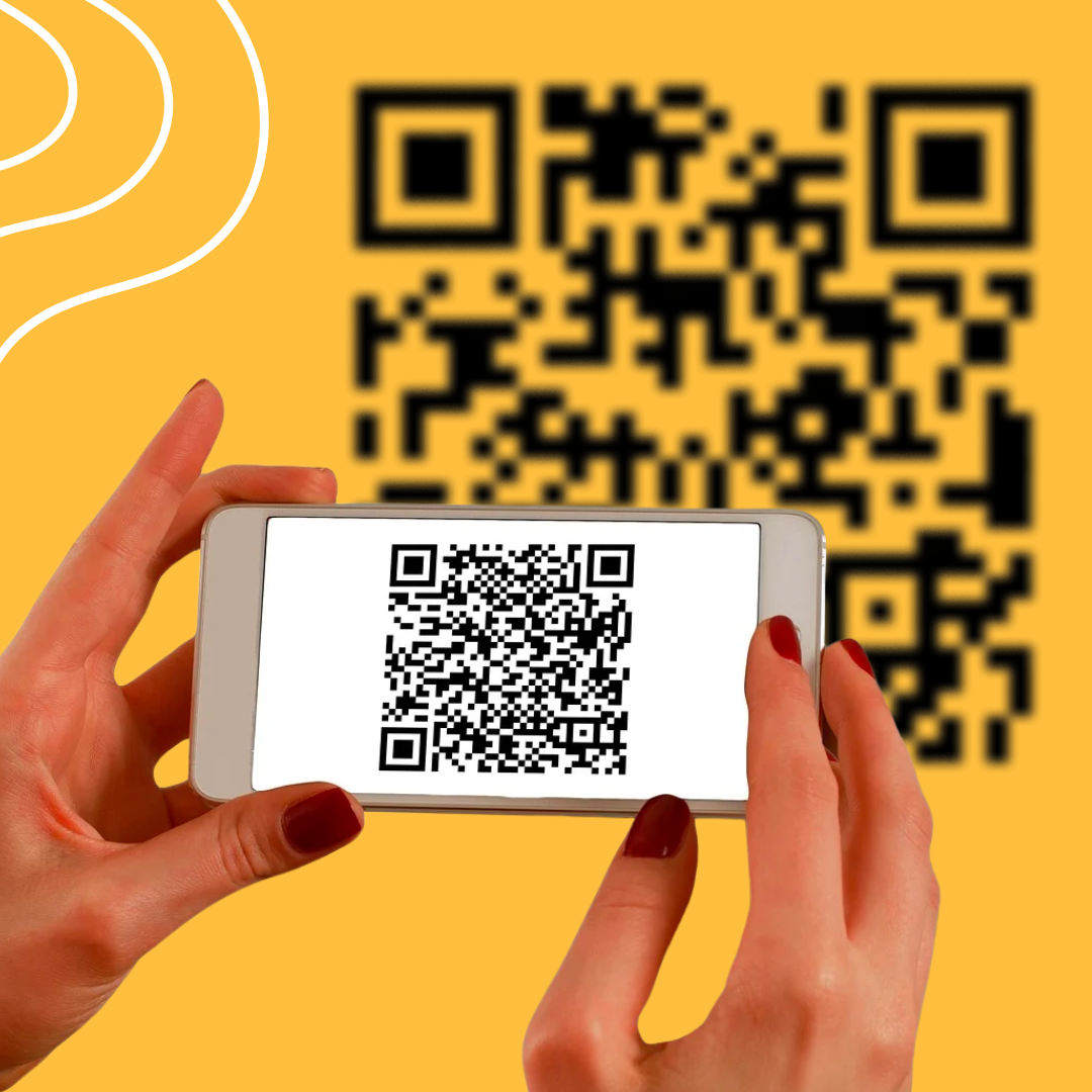 Hands holding a mobile phone showing with a QR code on the screen