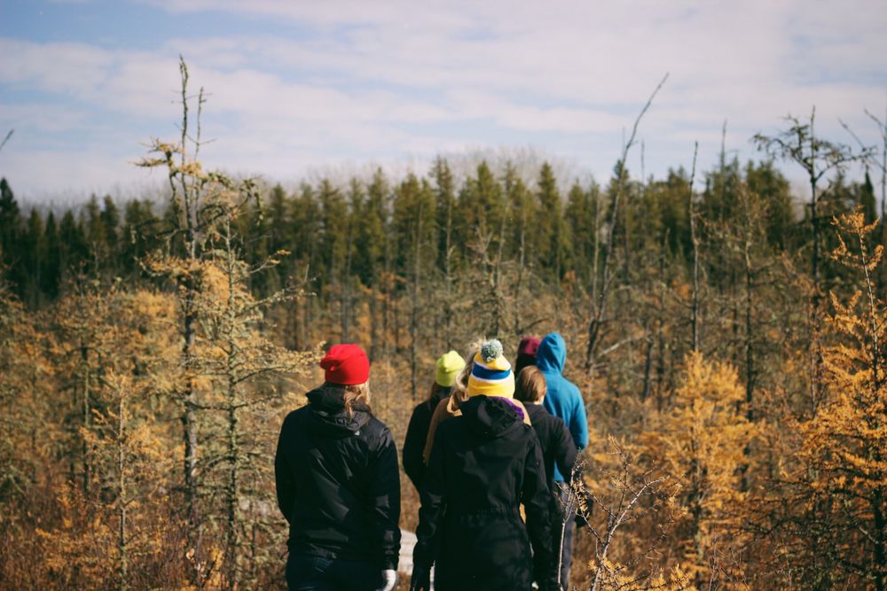 group of people on a hike in the fall